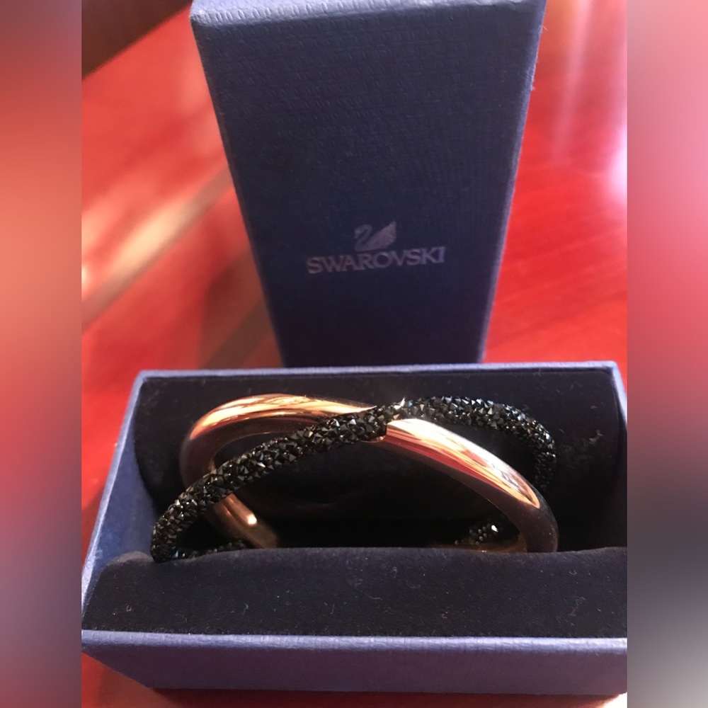 Black and rose gold Swarovski cuff. Brand new, never worn. Size medium in box